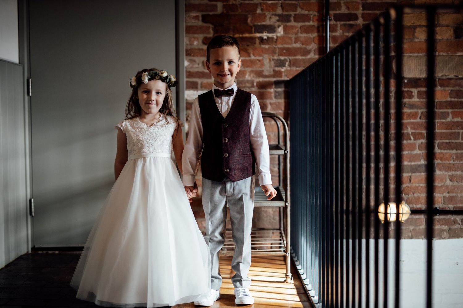 Wedding ceremony venue with exposed brick walls and elegant decor.