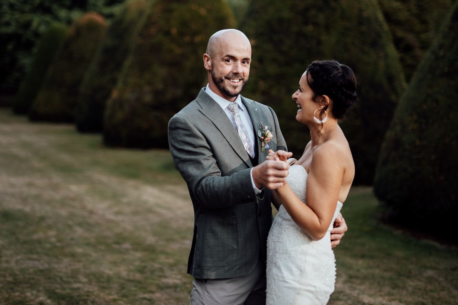 A romantic outdoor wedding moment captured in natural lighting.