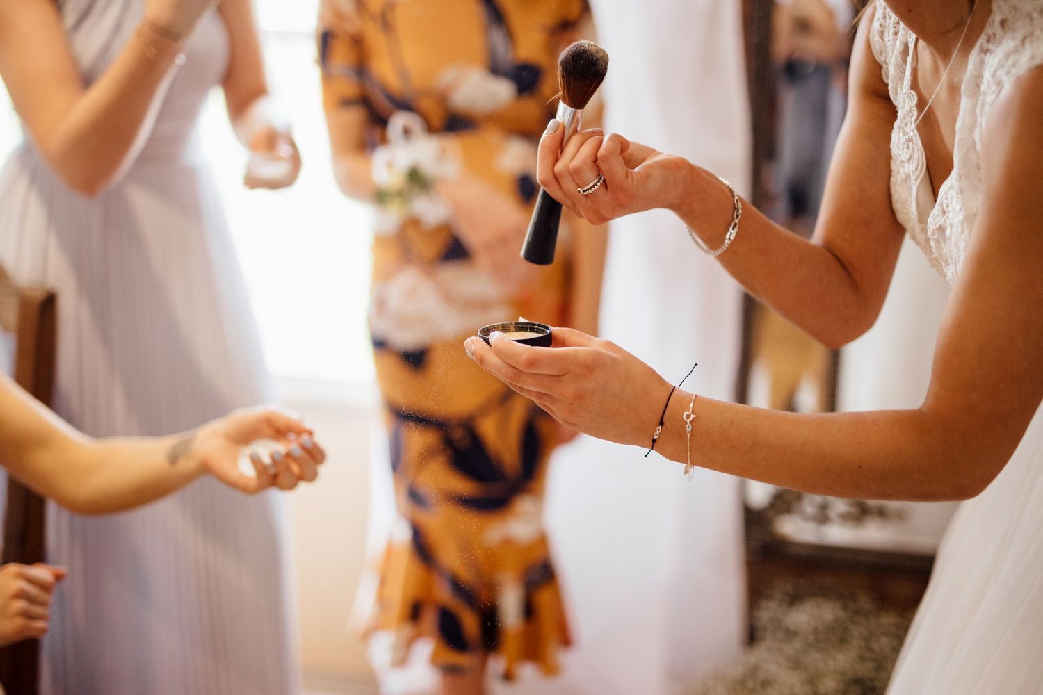 Wedding celebration with dancing and festive atmosphere in rustic indoor venue.
