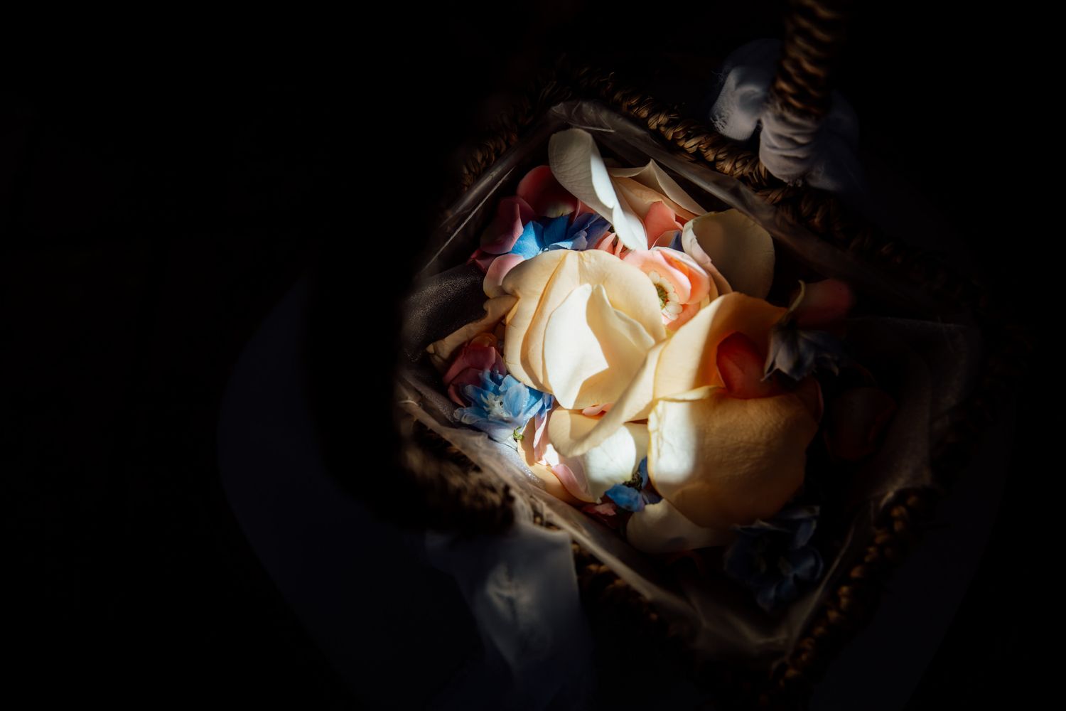 A decadent dessert with whipped cream and toppings photographed in dramatic lighting.