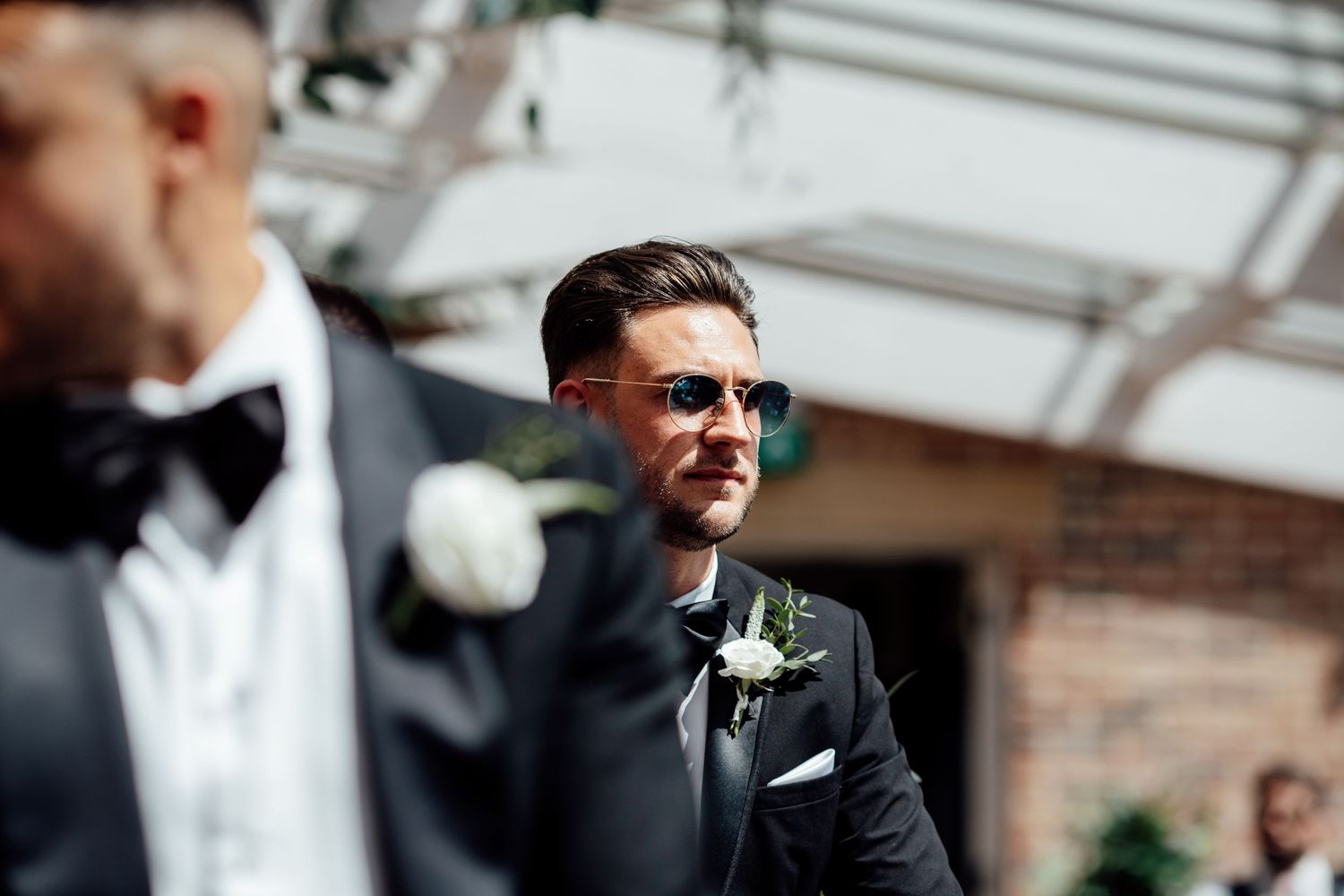 Wedding guests mingle and celebrate at an outdoor reception venue.