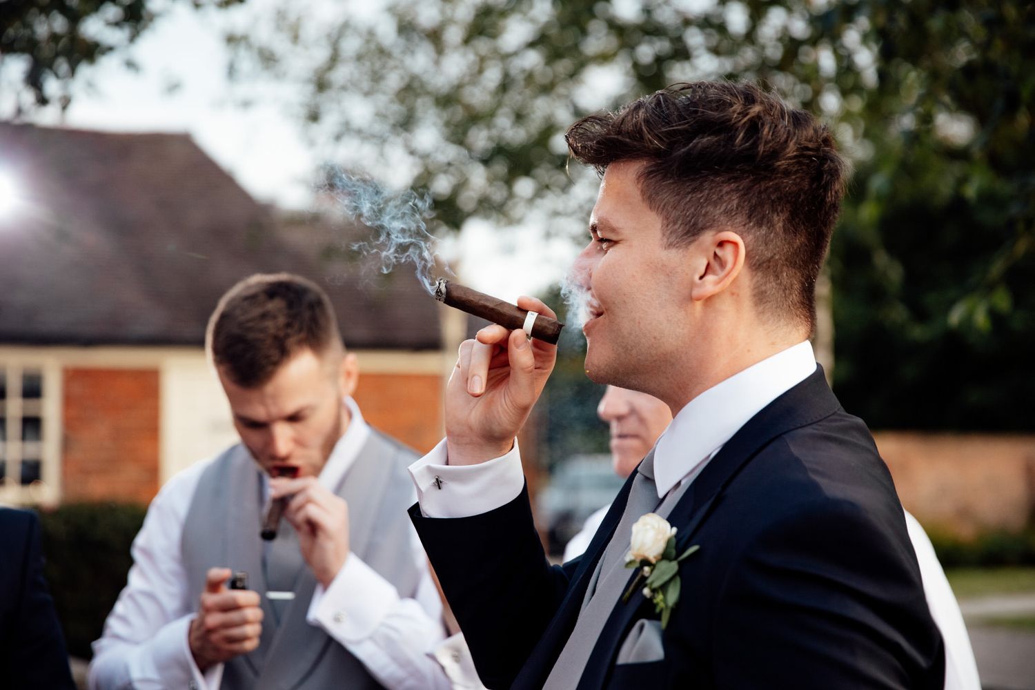 groom smoking a cigar