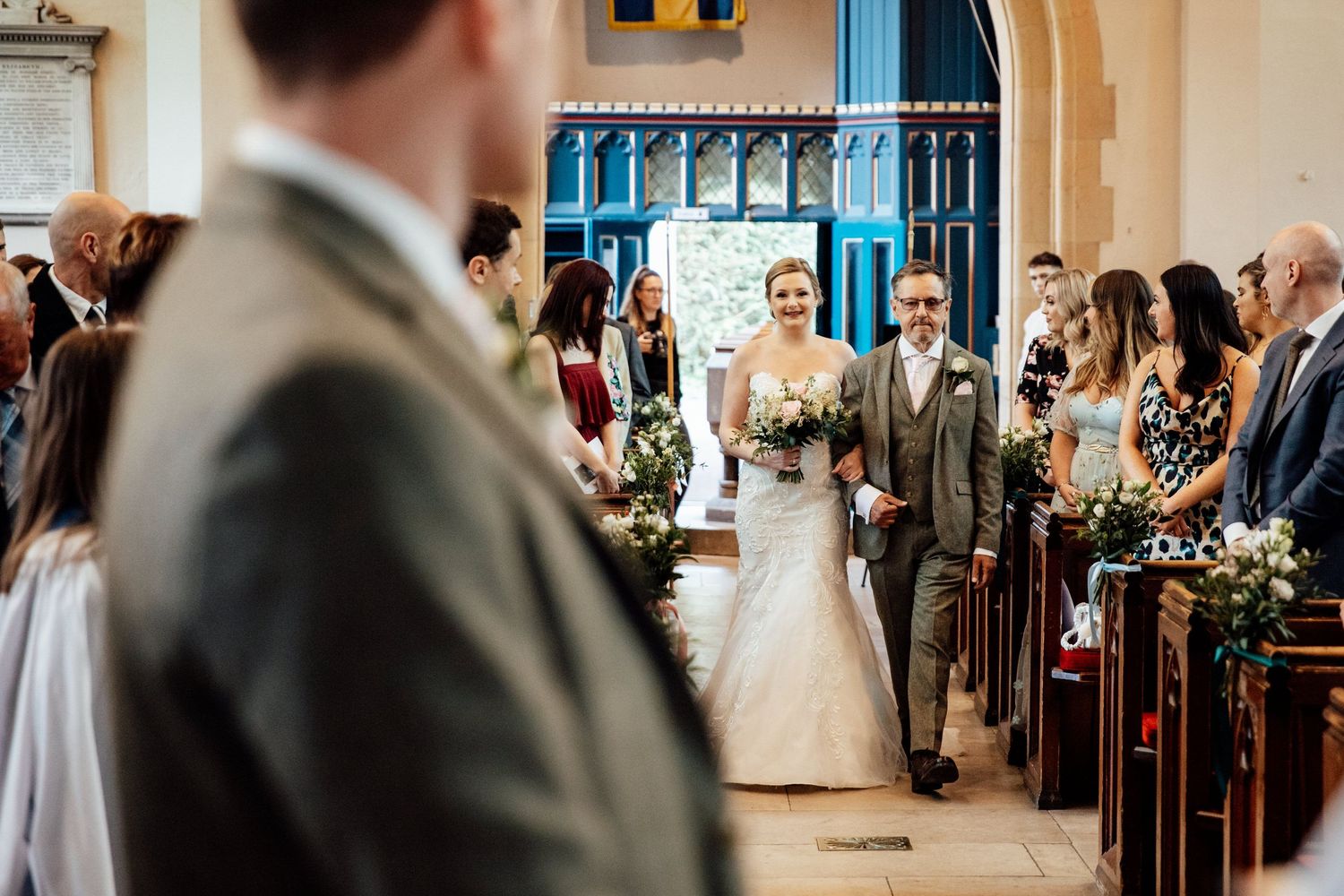 An elegant church wedding ceremony with beautiful architectural details and decorative elements.