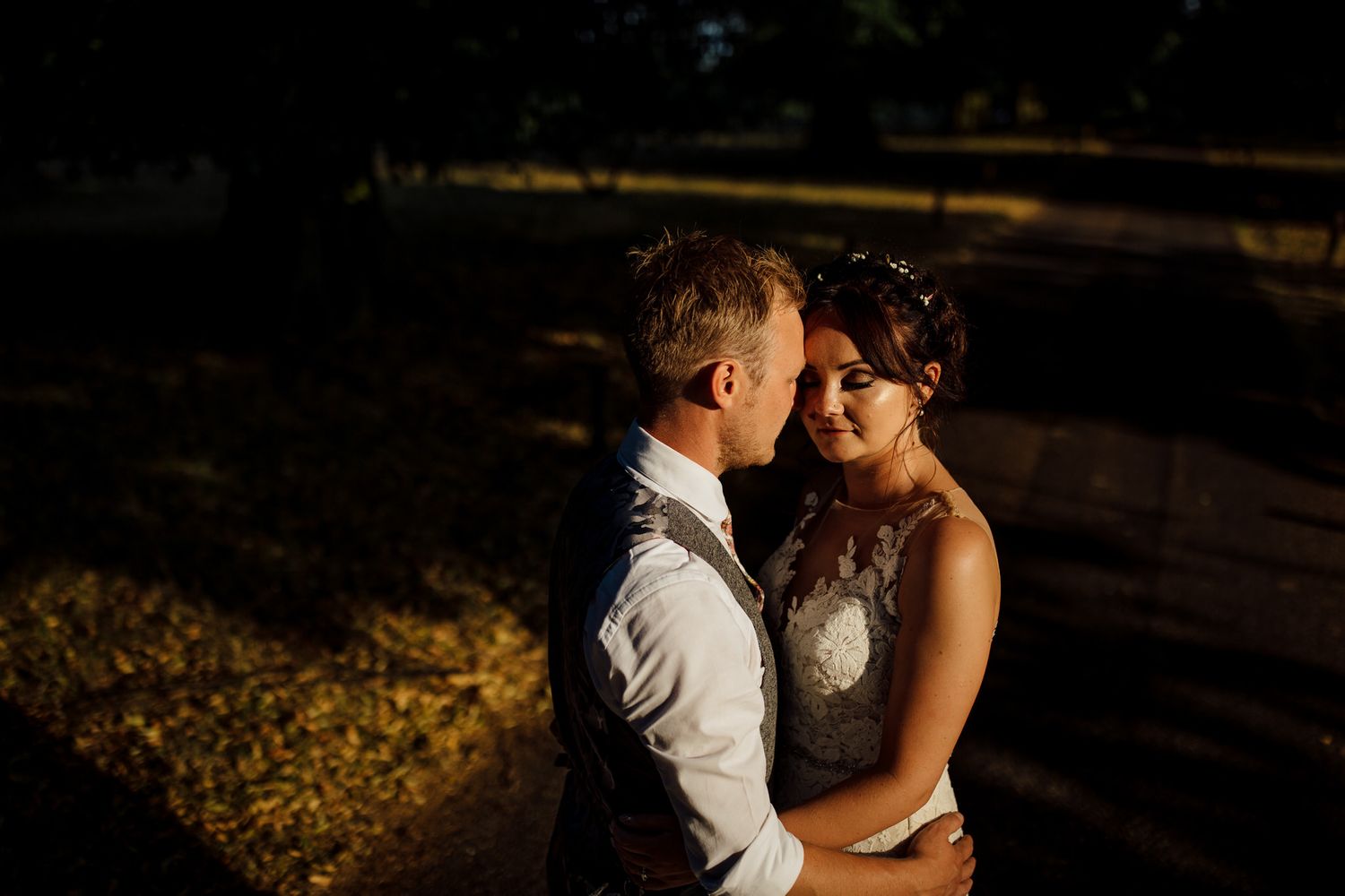 Romantic wedding couple silhouette in evening light.