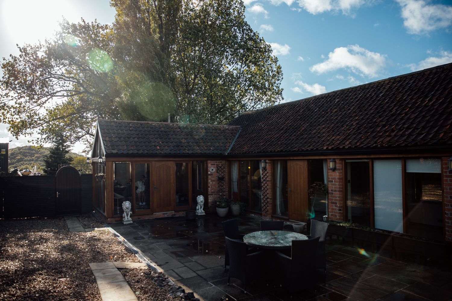 Modern cabin accommodations with dark roofs and wooden exterior in natural setting.