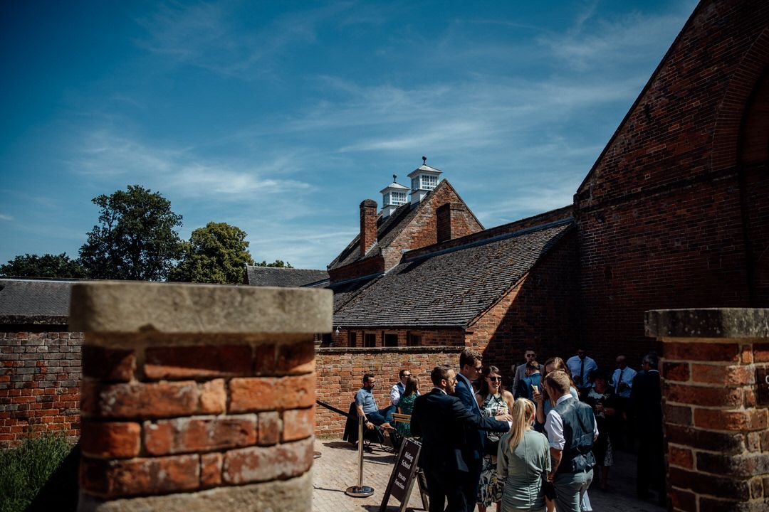 Exterior view of a brick building with blue sky overhead.