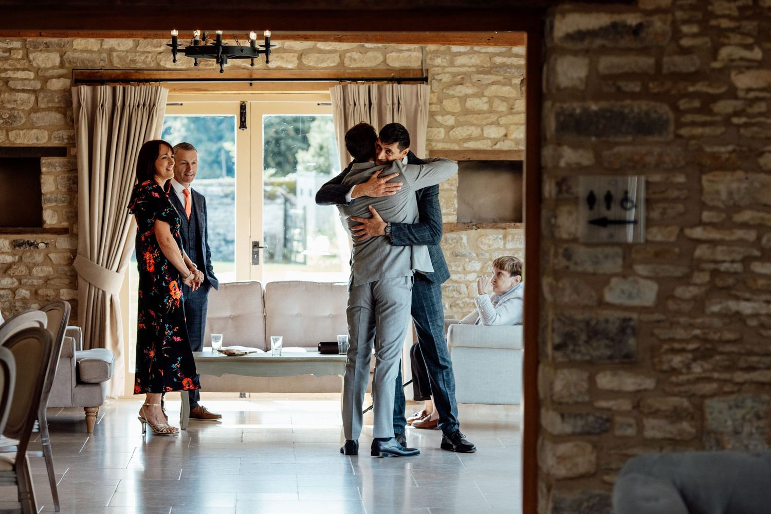 Wedding venue interior showing stone walls and natural lighting.