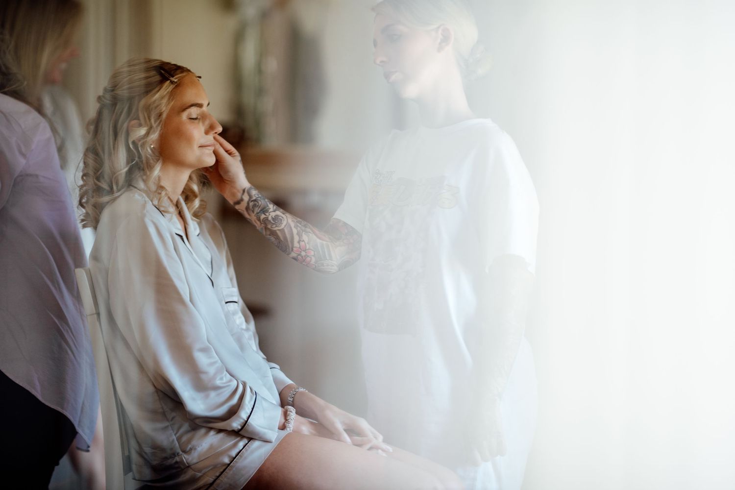Soft, ethereal getting ready moments with white fabric and natural light.