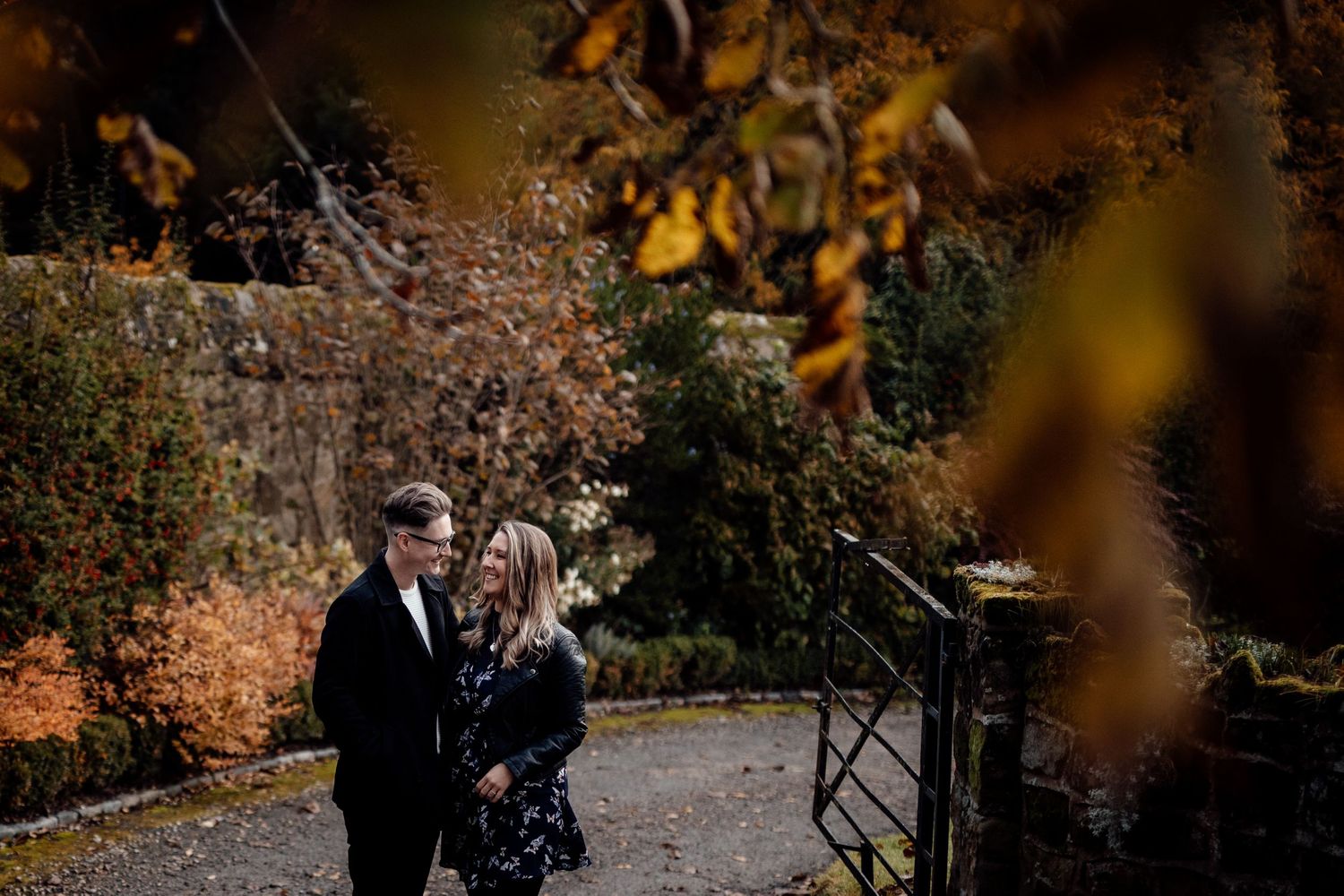 Fall colors create warm backdrop for romantic outdoor photoshoot.