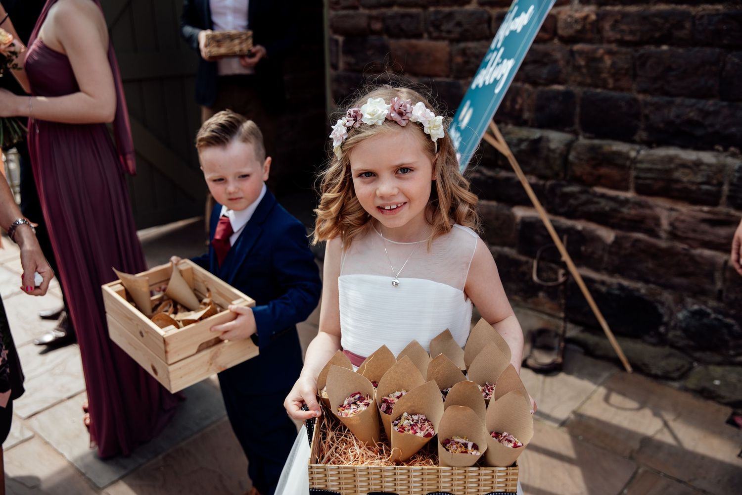Wedding party enjoying desserts and treats at a rustic reception.