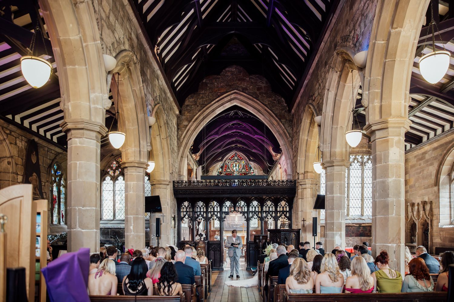 Historic church interior with vaulted ceiling and gothic architectural details.