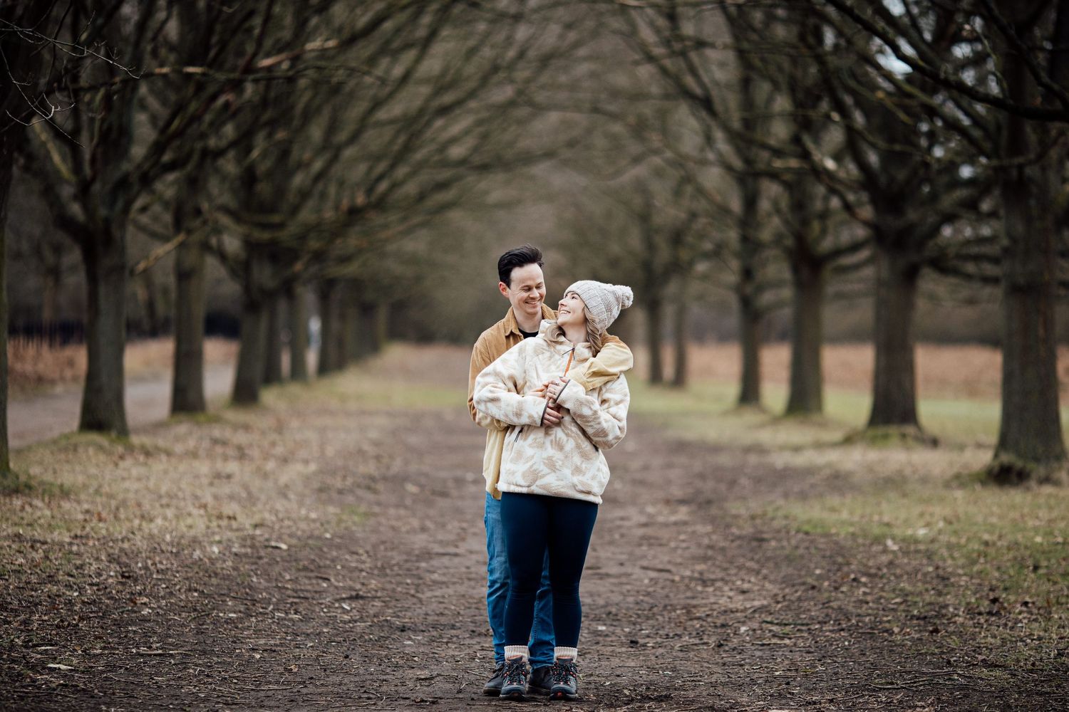 Romantic outdoor photography session in a serene winter park setting.