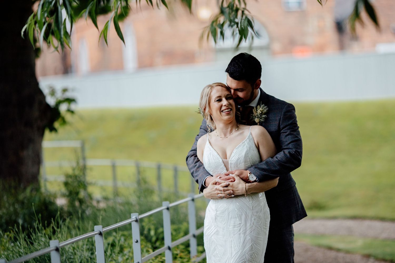 Romantic couple portrait session in outdoor garden setting with natural greenery.