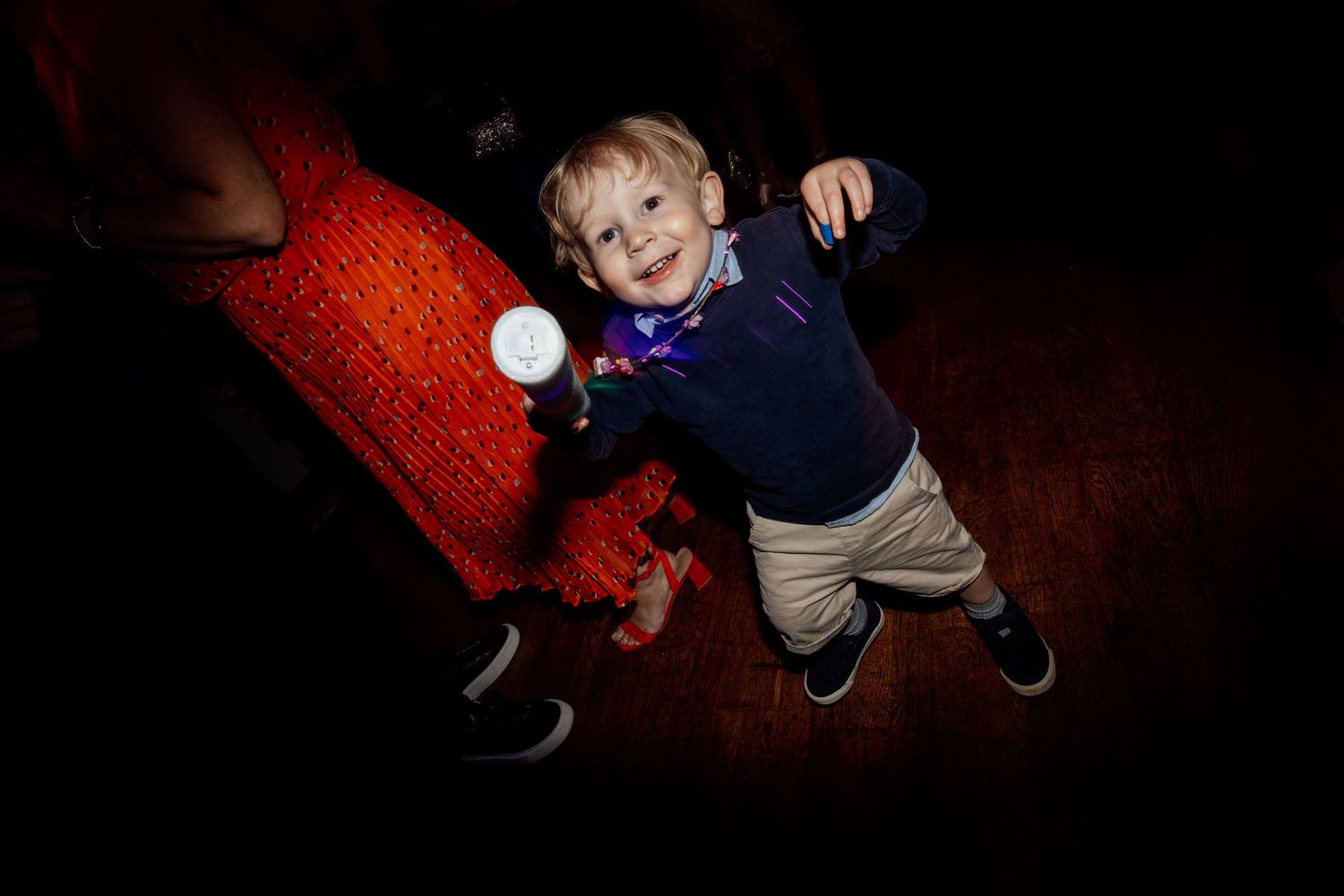 Creative nighttime portrait using red lighting effects.