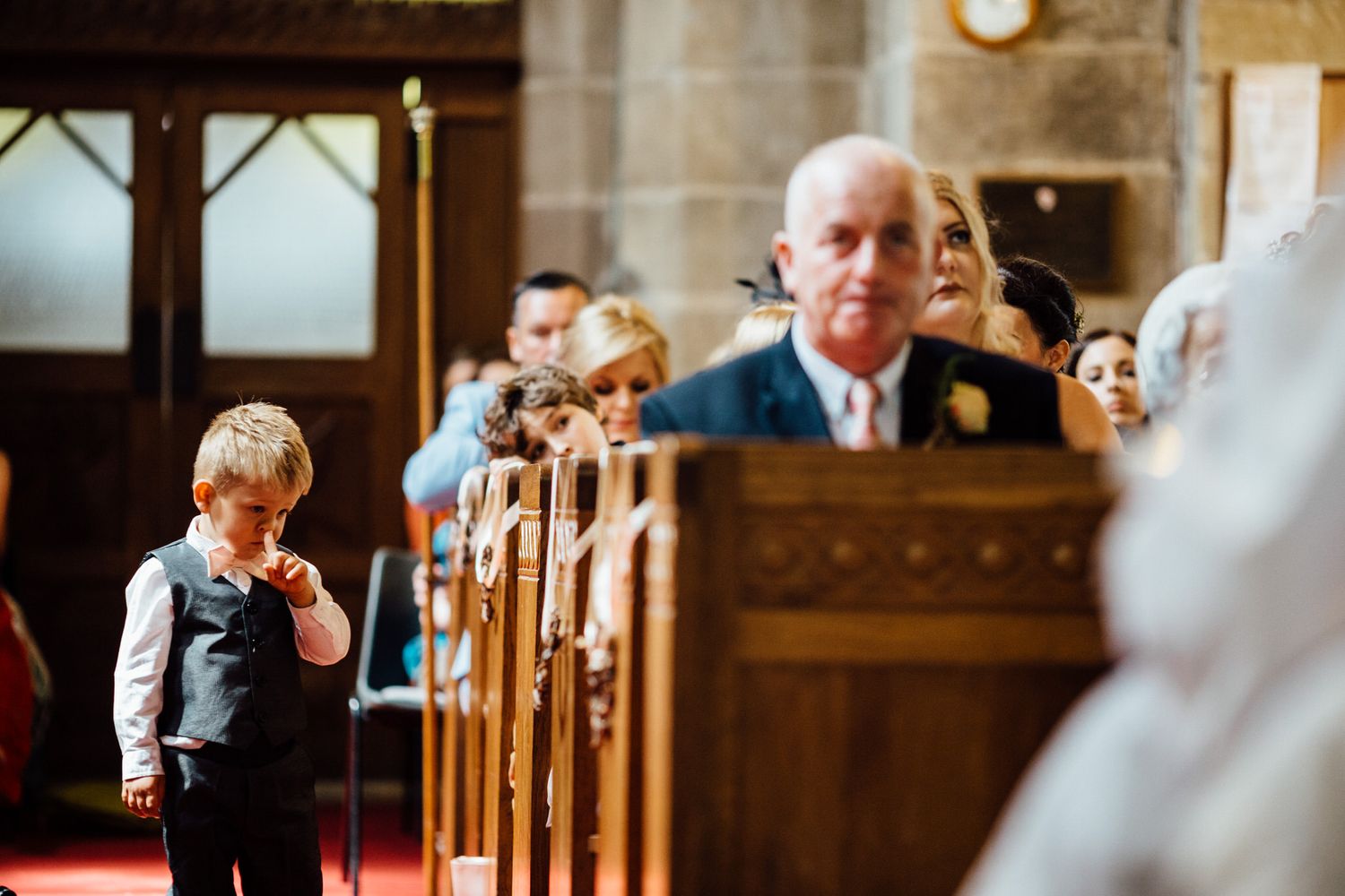 Guests observe a special moment during a traditional church wedding ceremony.