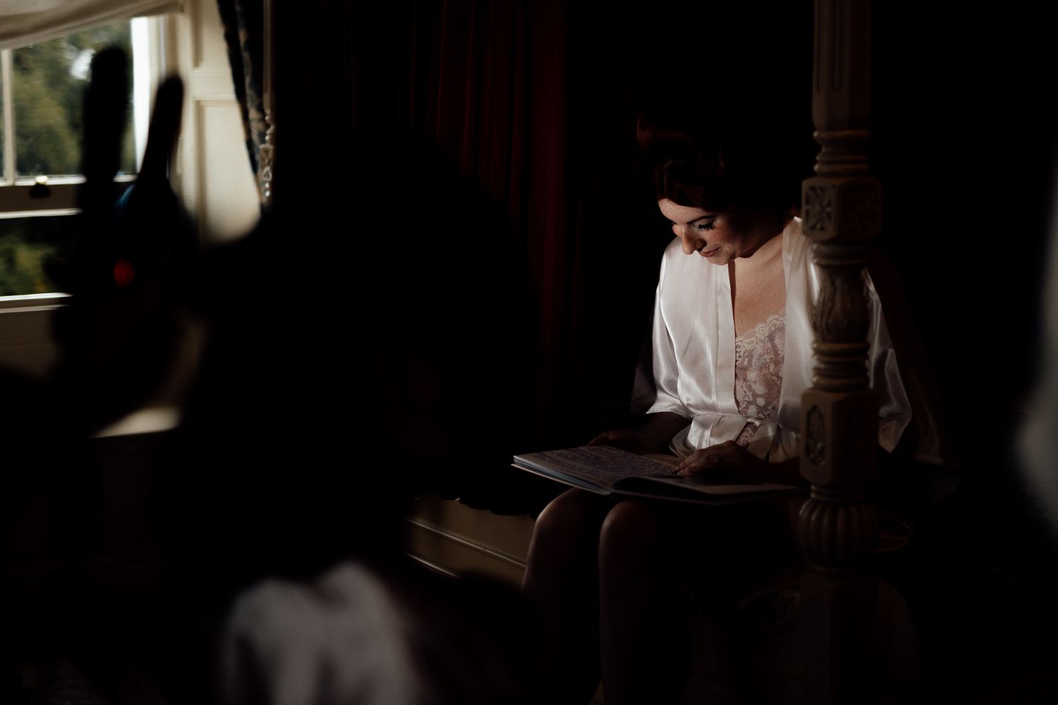 Dramatic shadows and light create moody ambiance in wedding venue.