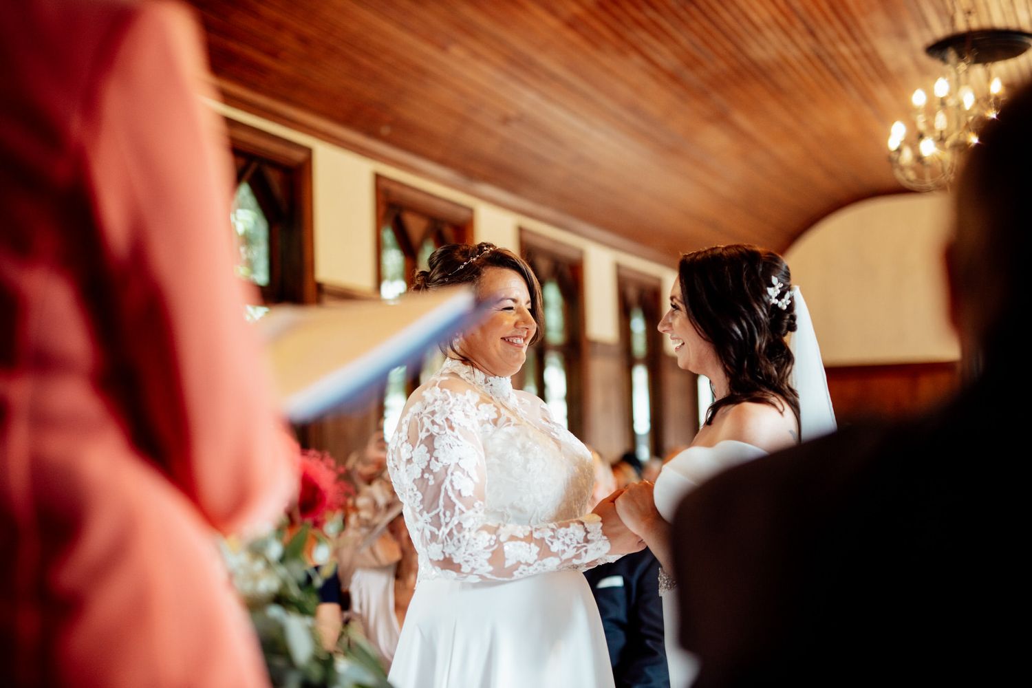 Elegant wedding reception venue with warm lighting and chandelier details.