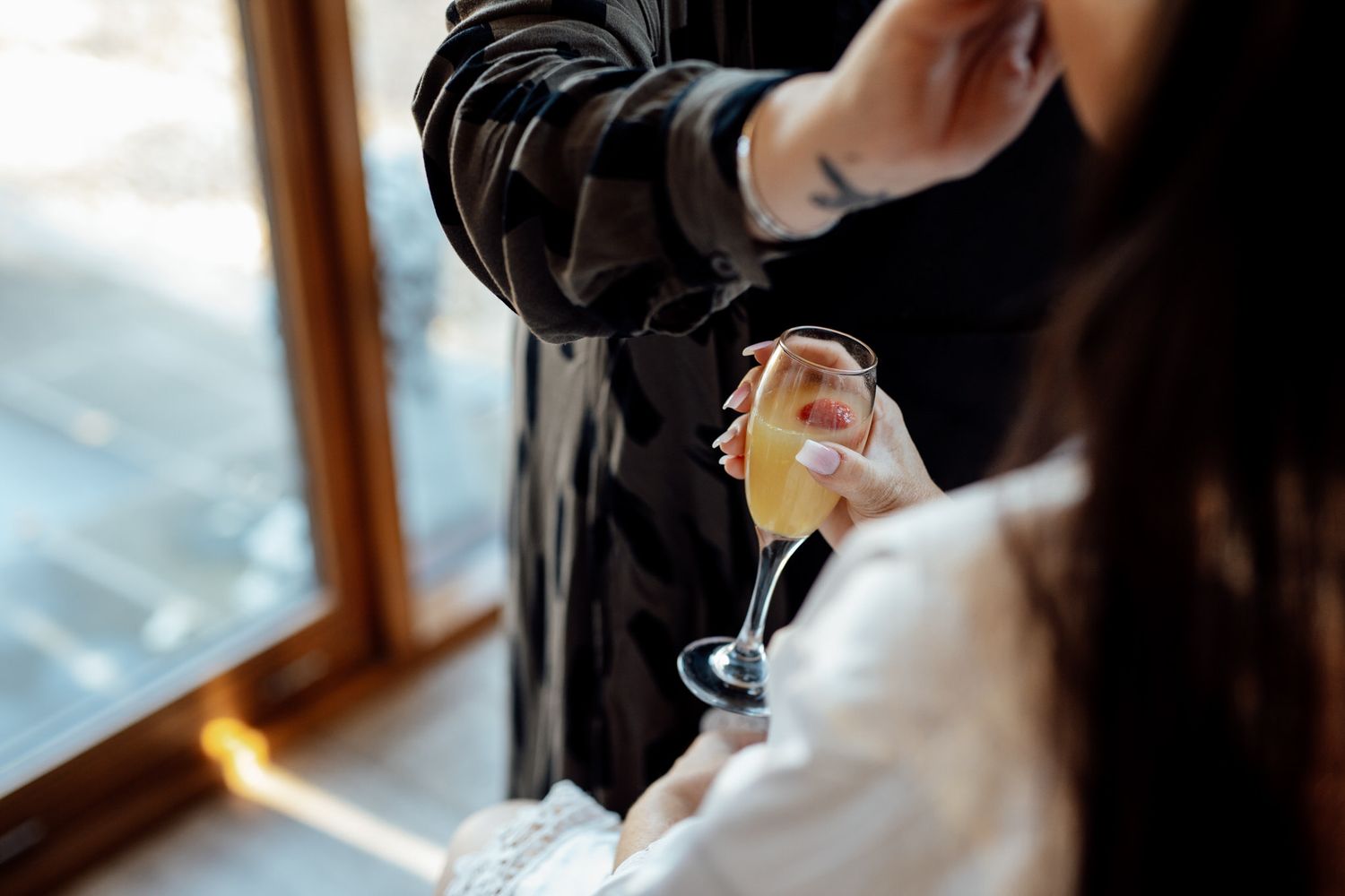 Close-up of wedding day preparations in natural window light.