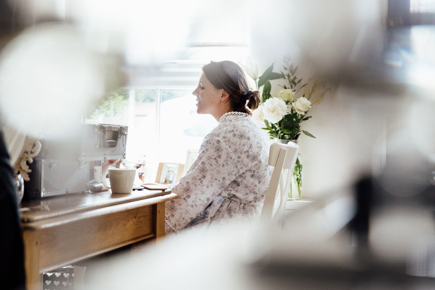 Soft focus wedding morning preparations with natural window light.