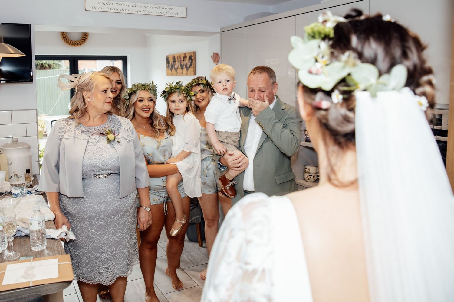 Candid moments of wedding preparations in a bright indoor space.