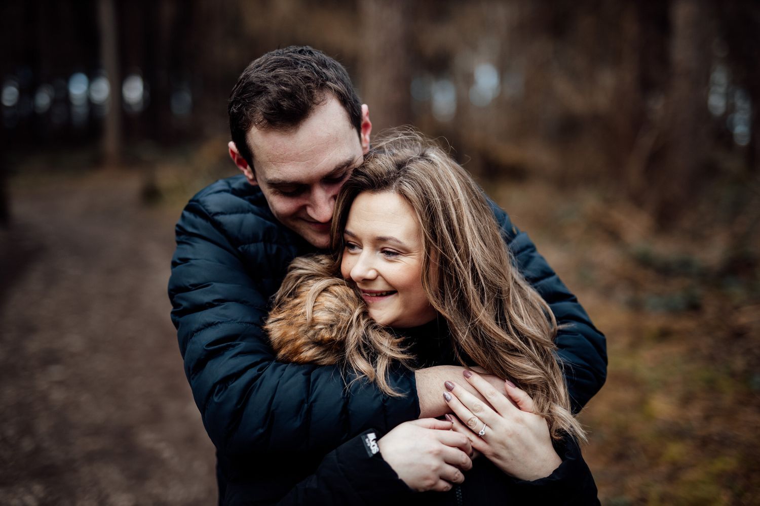 Intimate moment captured between couple during outdoor photo session.