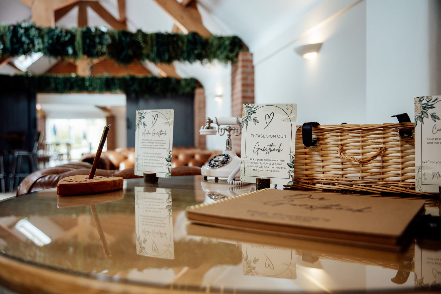 Wedding reception decor details with rustic wooden elements and signage.