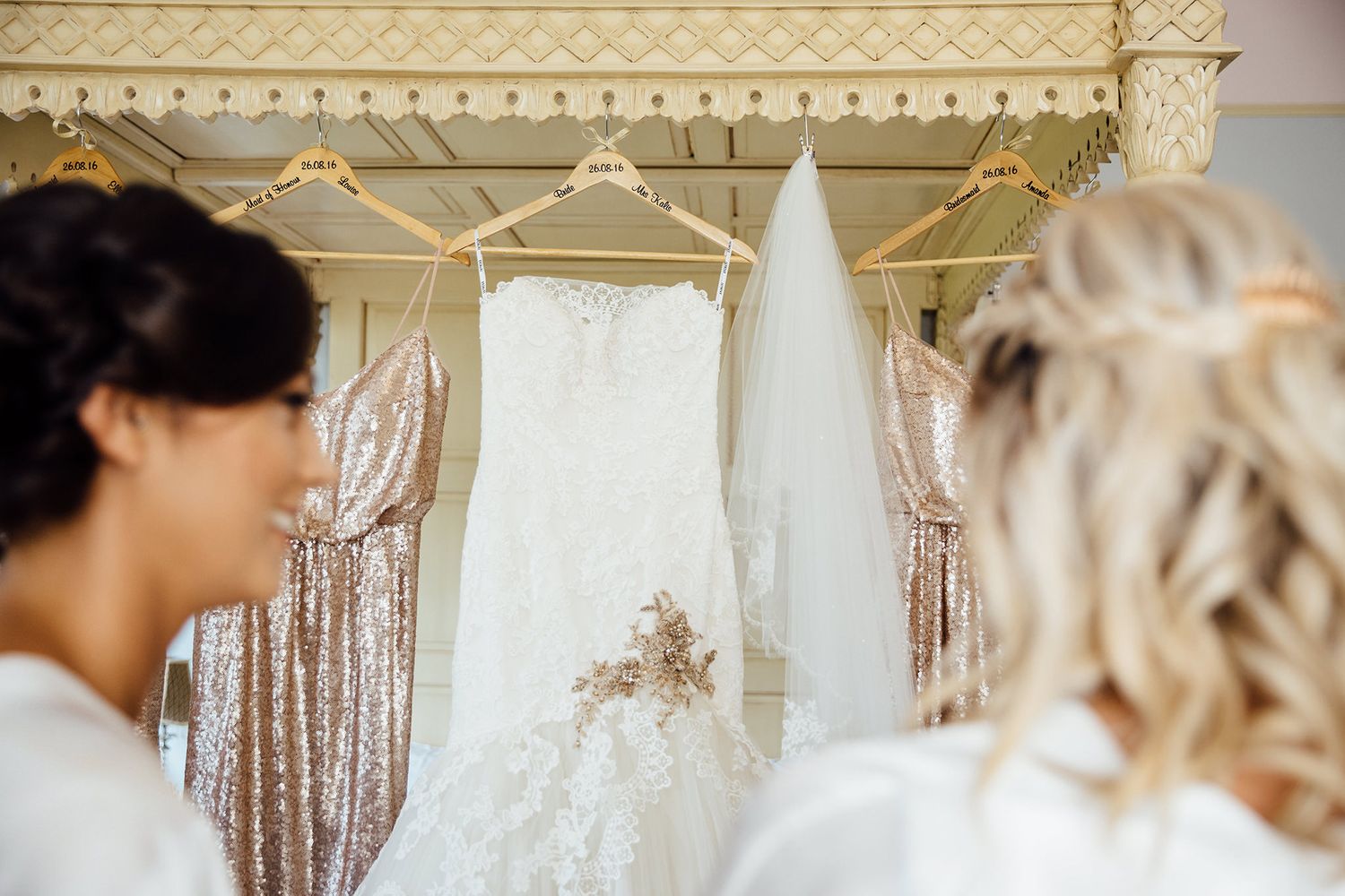 Ornate gold trim details on cream colored walls with sparkly decor.