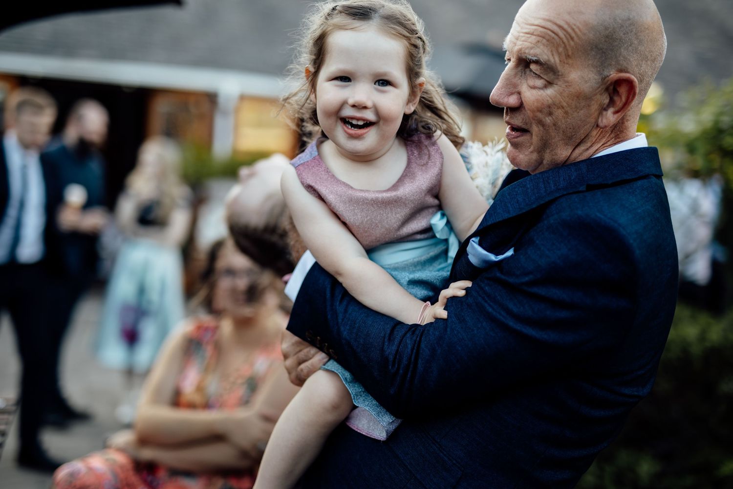 Heartwarming moments shared between guests during outdoor wedding festivities.