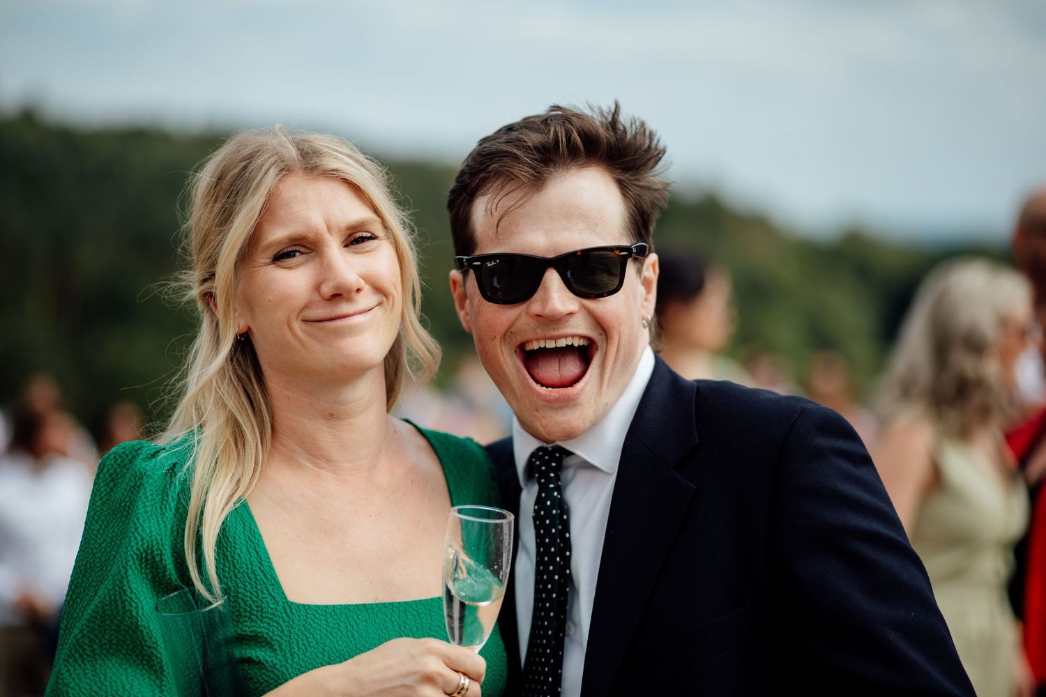 Couple sharing a joyful moment outdoors on their wedding day.