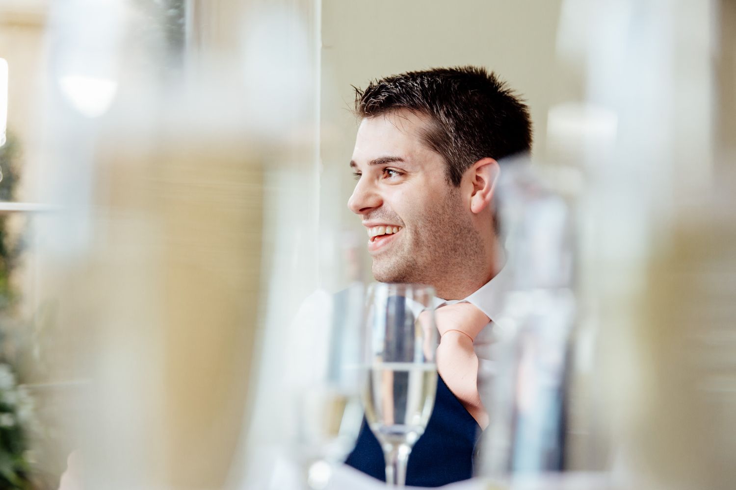 Elegant wedding reception venue interior with soft natural lighting and classic decor.