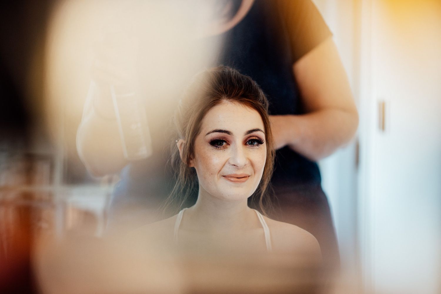Soft focus portrait shot with warm lighting and dreamy atmosphere.