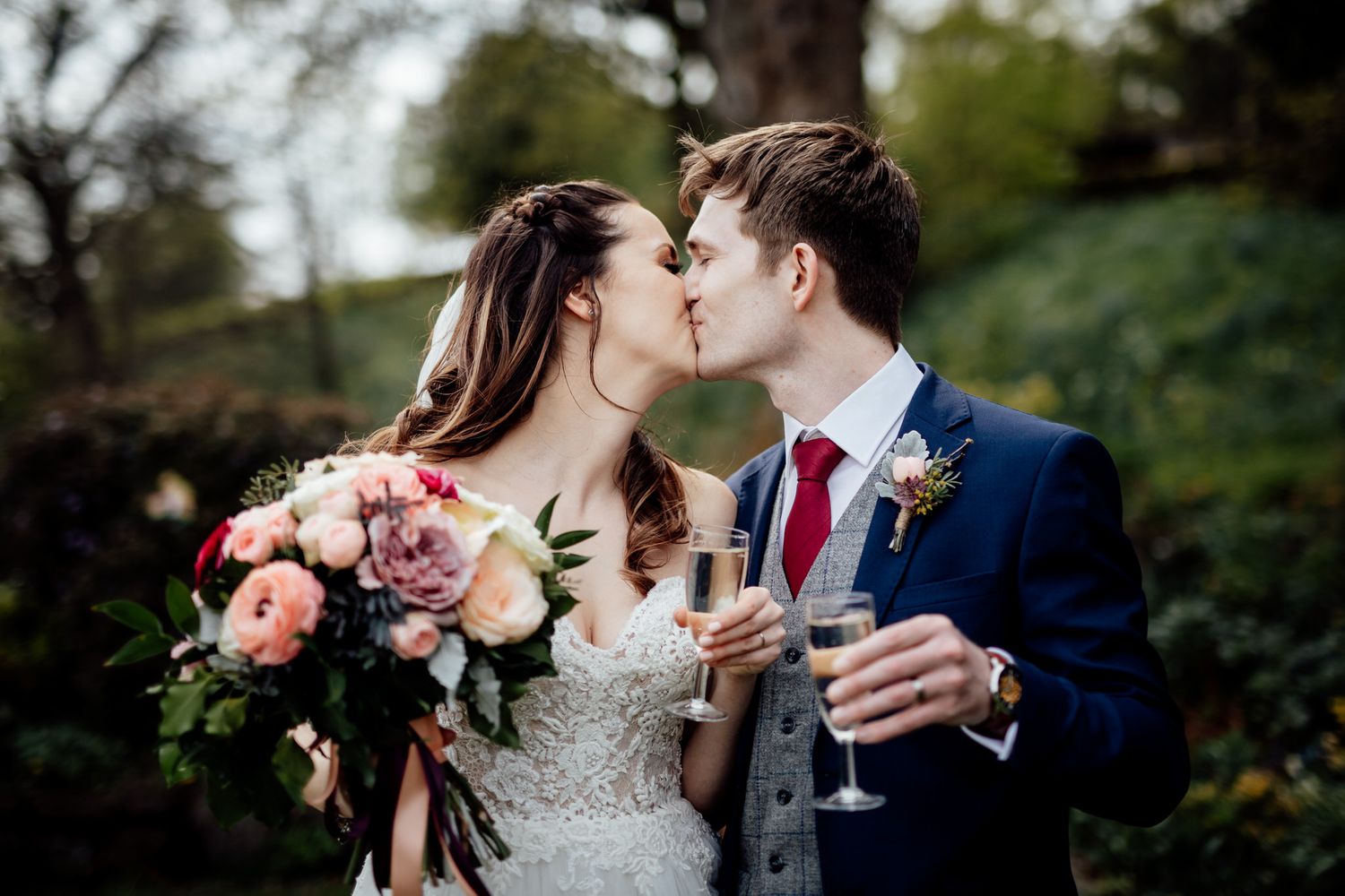 Romantic outdoor wedding portraits in a garden setting with soft natural light.