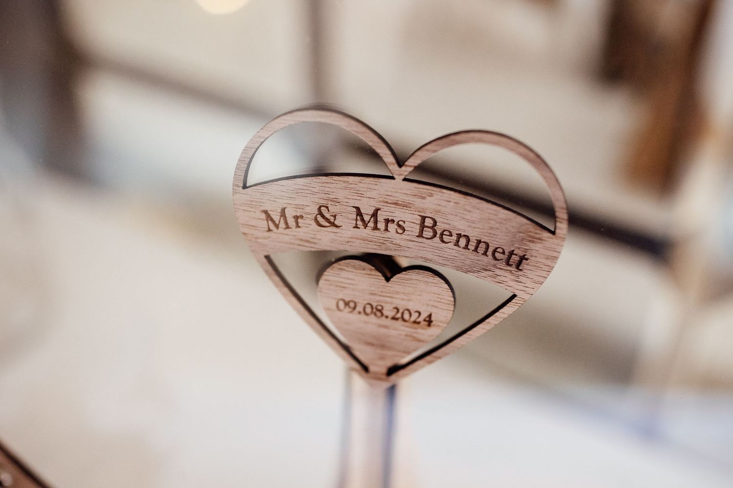 Wedding rings photographed with Mr & Mrs text detail in soft focus.
