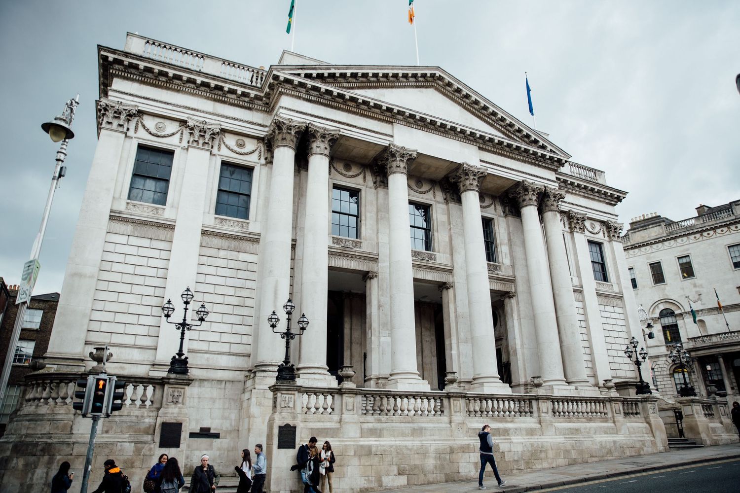 Exterior view of a grand neoclassical building with white stone columns.
