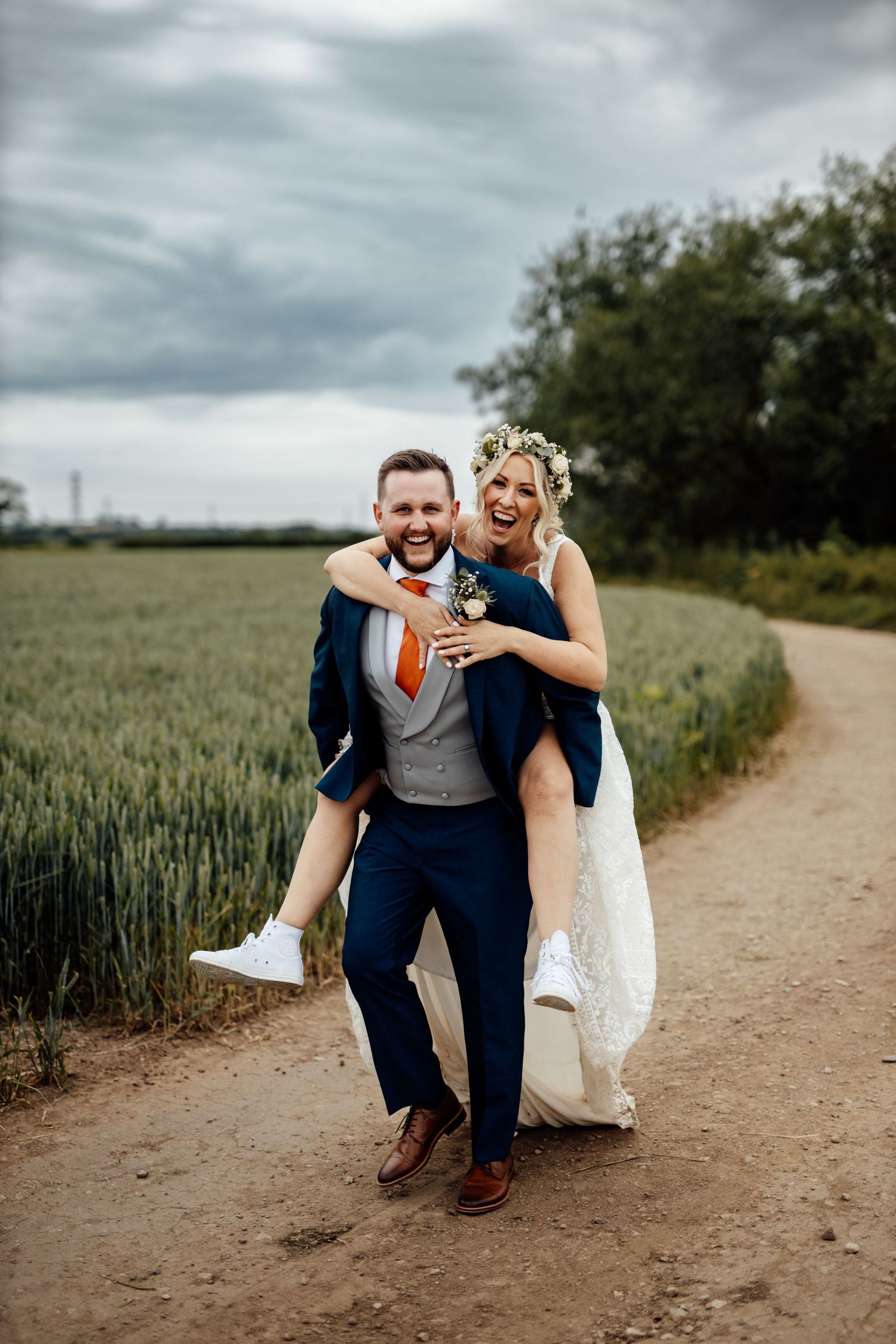 Fun wedding photo sequence showing a couple running and laughing on a dirt path.