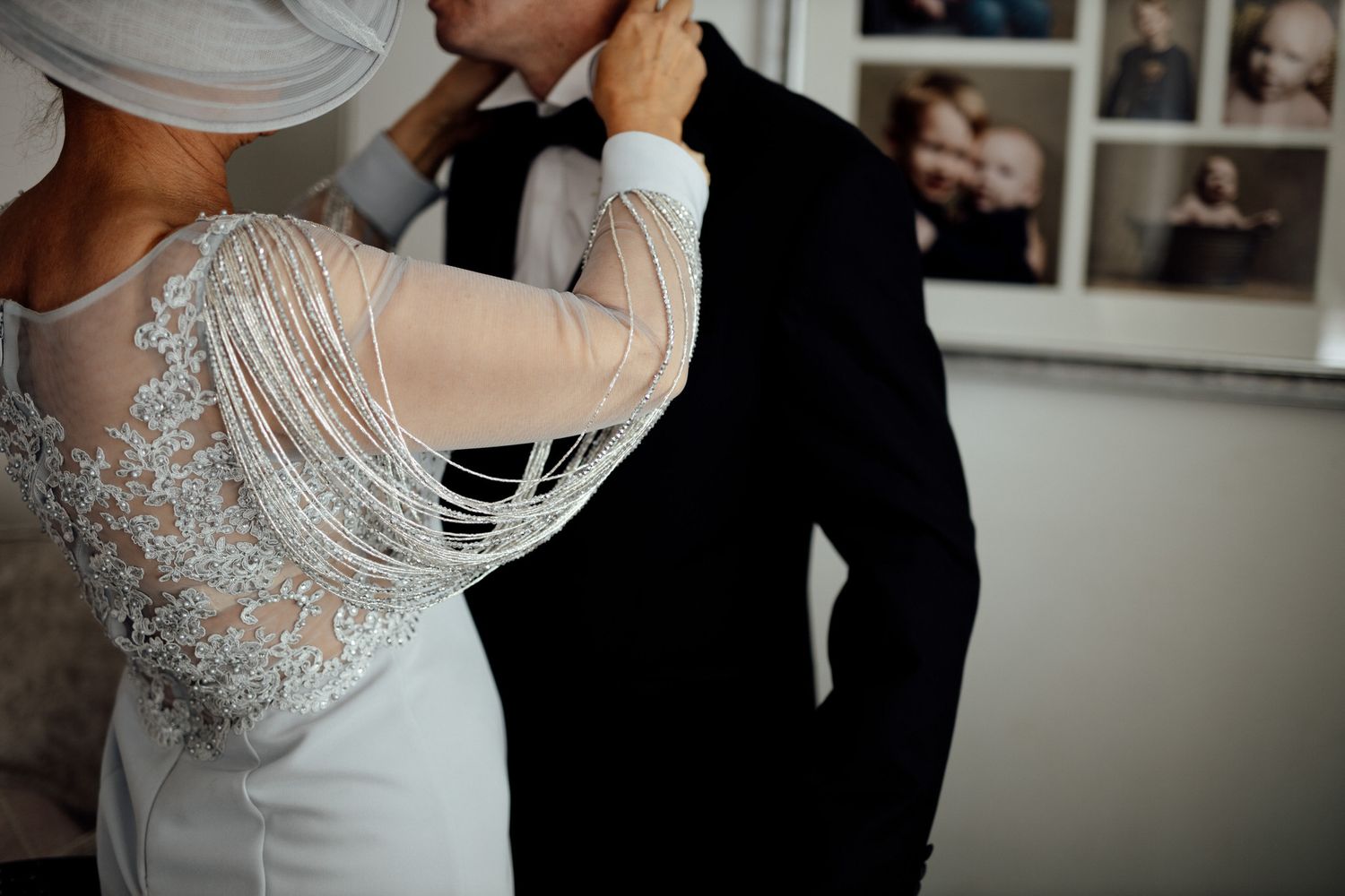 Close-up details of intricate beaded wedding dress bodice.
