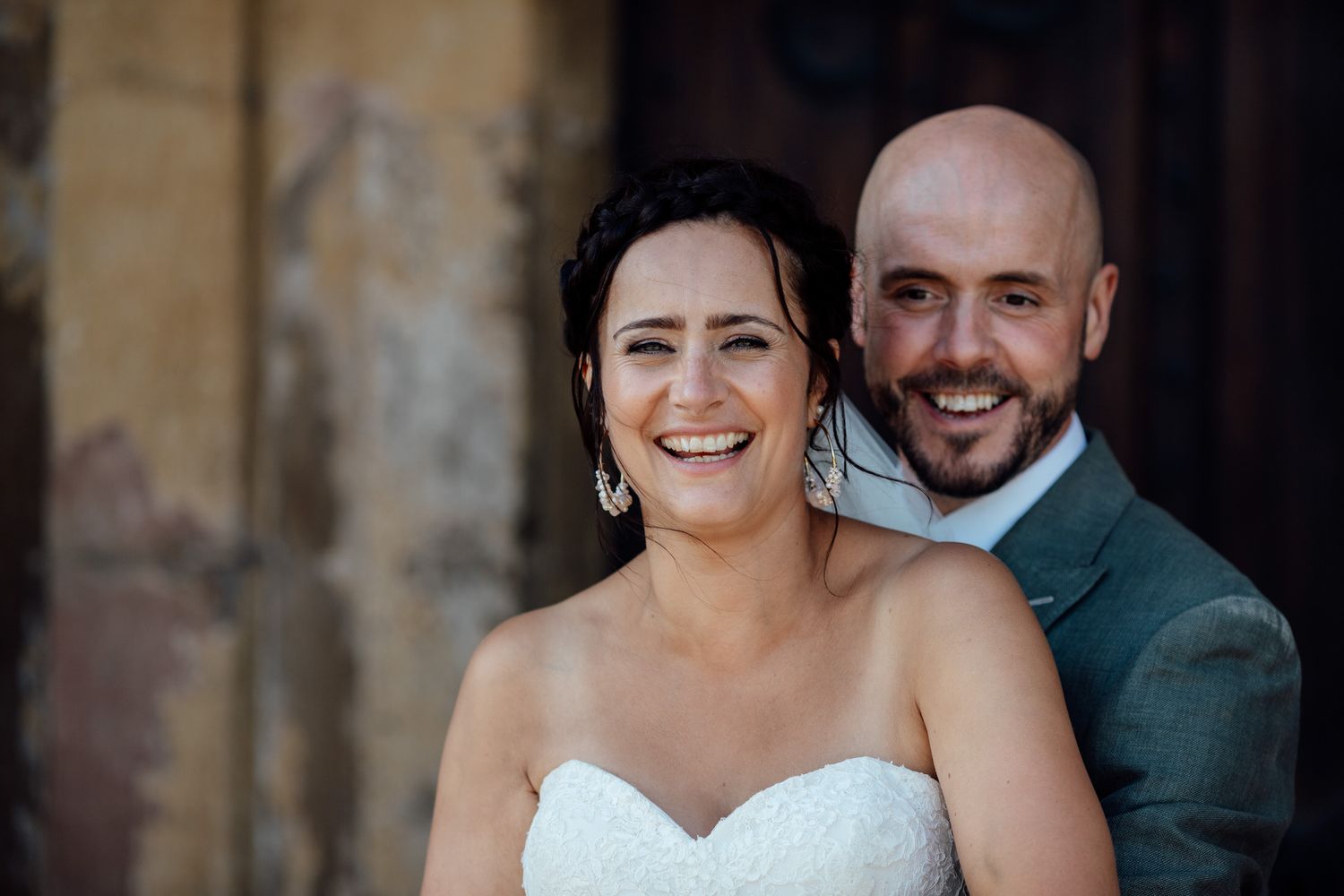 Intimate wedding portraits showing tender moments between newlyweds in natural light.