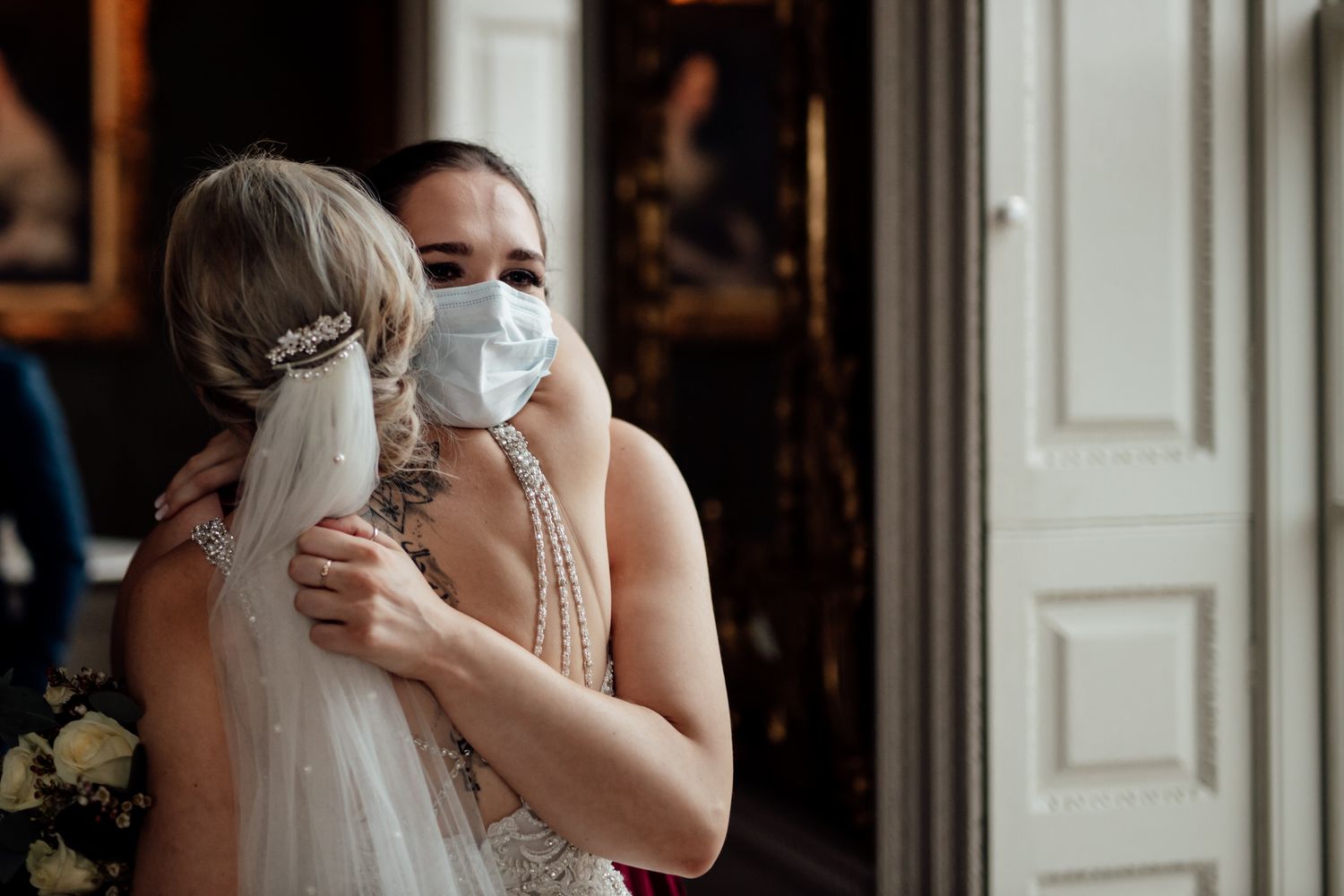 Intimate moments shared during wedding preparations in an elegant indoor setting.