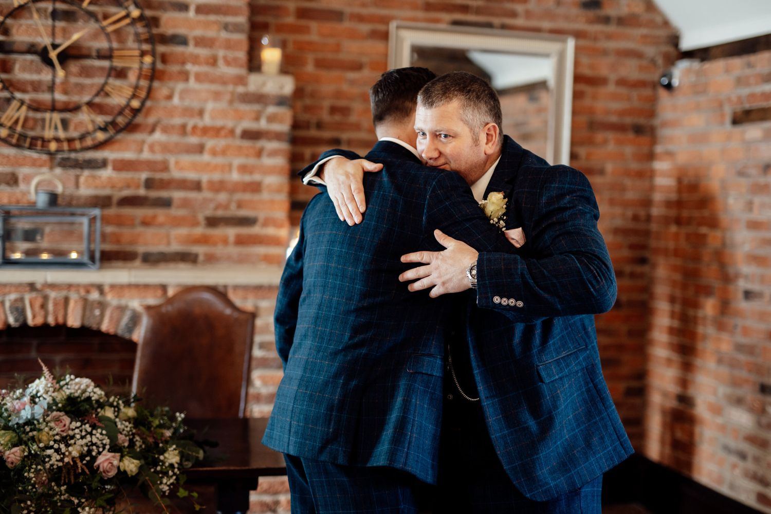 Wedding couple embraces during first dance in romantic venue setting.