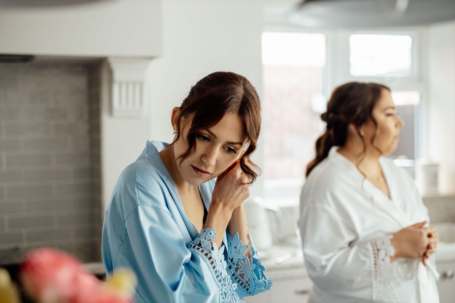 A sequence of images showing someone in a light blue outfit looking stressed or emotional in an office setting.