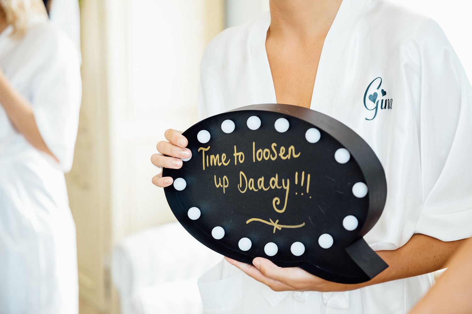 Series of decorative black signs with white lettering displayed against white background.