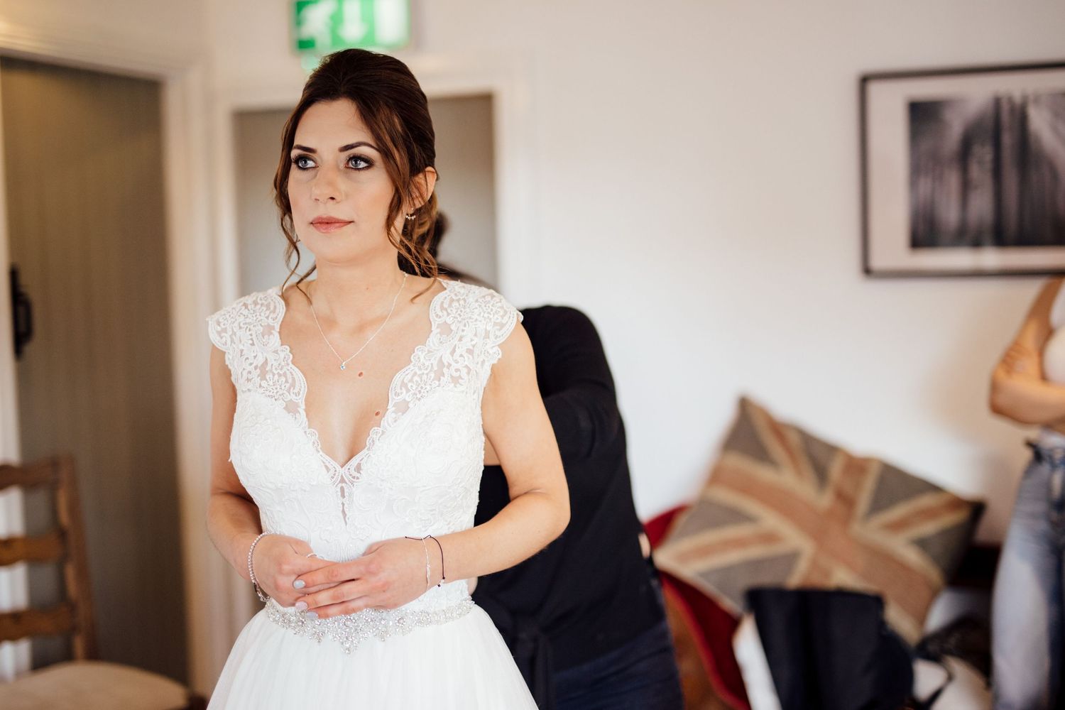 Wedding preparation scene with elegant lace details and soft natural lighting.