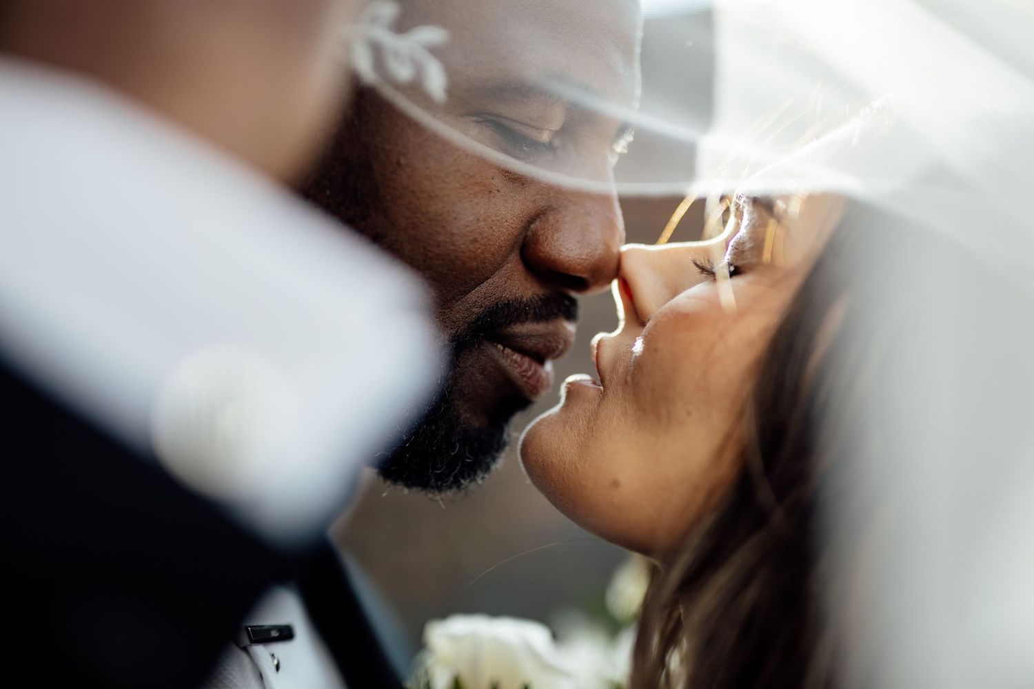 Romantic wedding couple shares an intimate moment during their first dance at the reception.