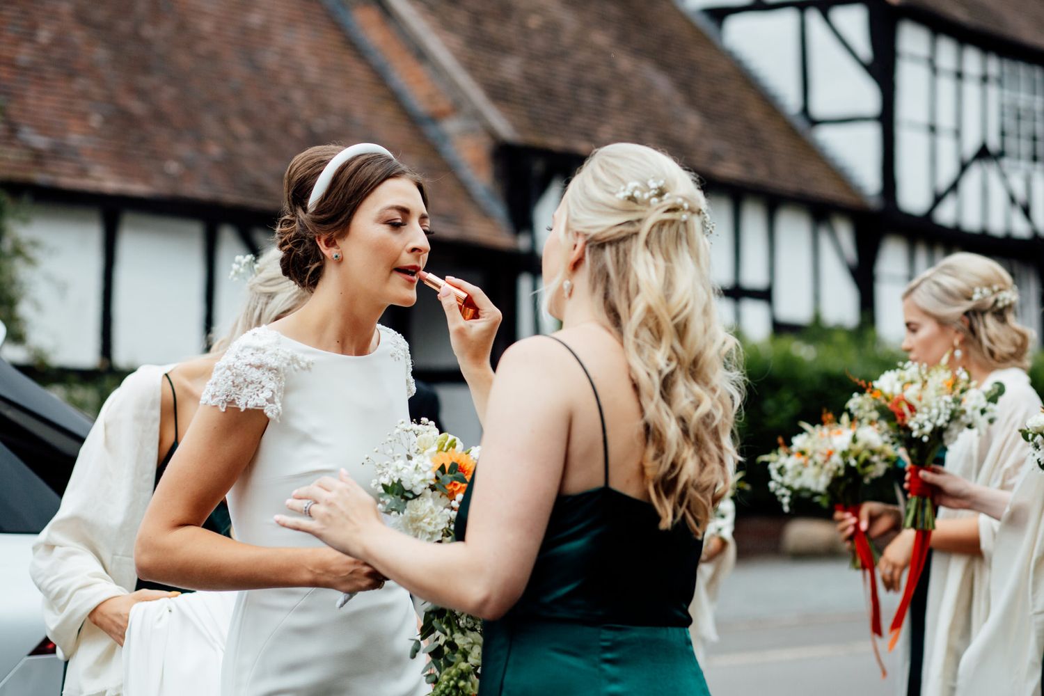 Casual outdoor wedding reception interactions between guests.