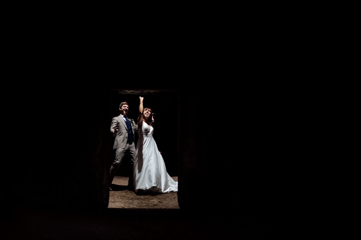 Artistic black and white wedding photos displayed against a dark background.