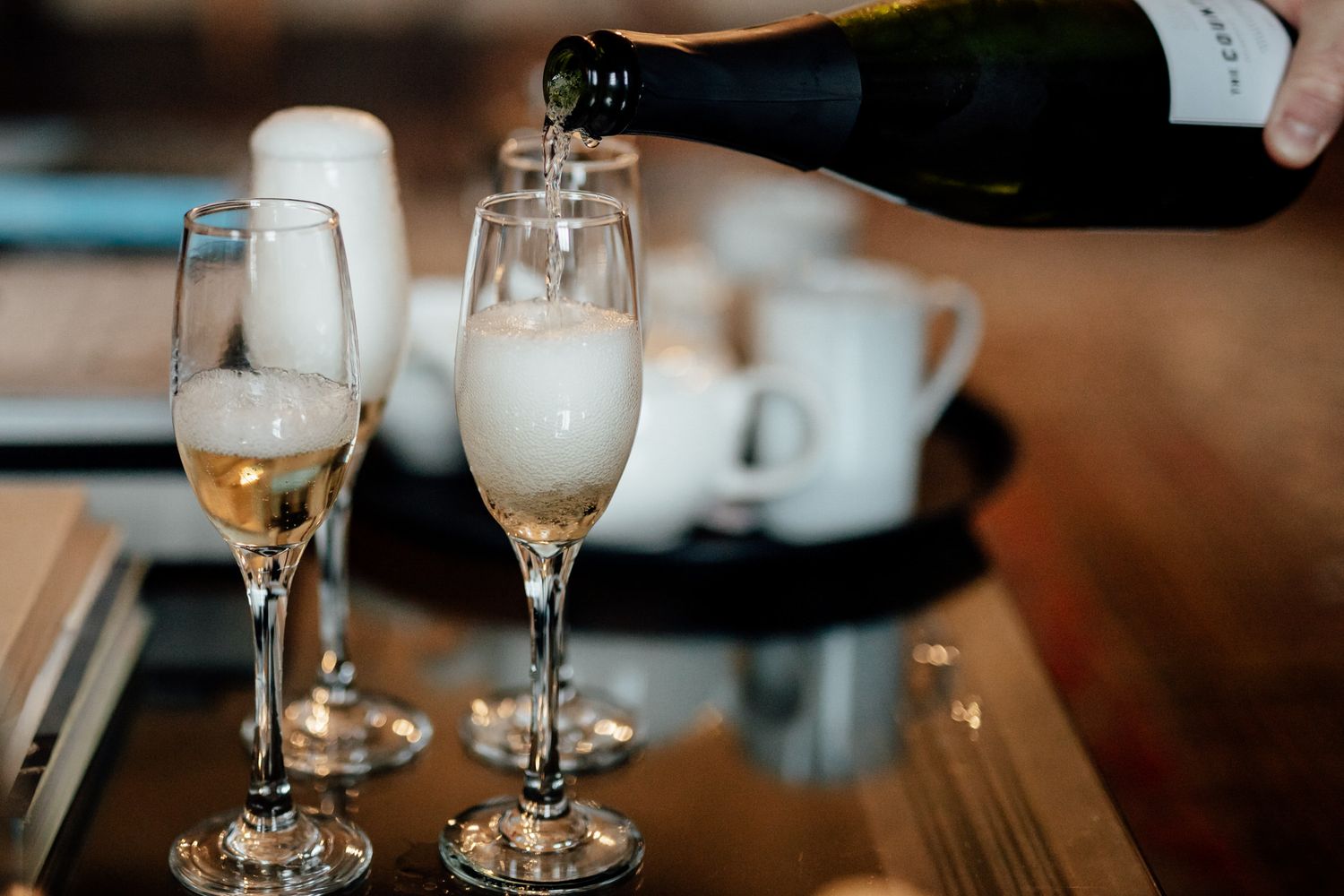 Champagne glasses and wedding reception drinks on elegant table setting.
