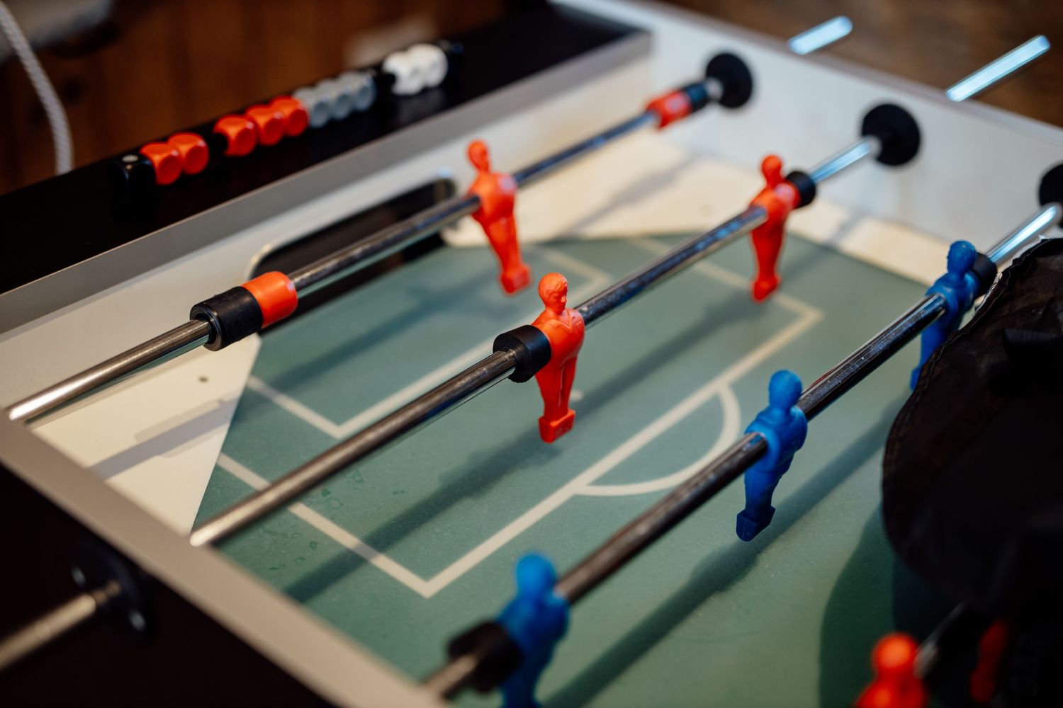 Close up of table football game figures at wedding reception.