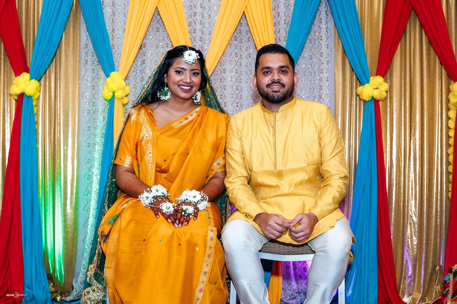 Bengali Holud ceremony for Shadman and Monia near Baltimore, MD, featuring traditional yellow South Asian wedding attire and vibrant decor.