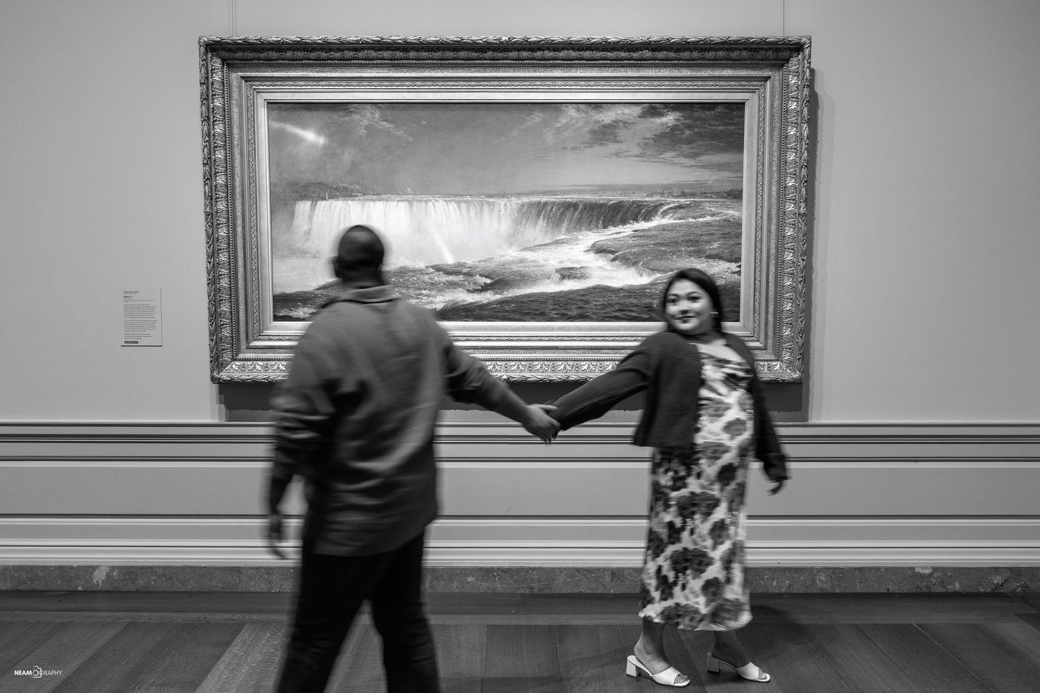 B&W anniversary session for a South Asian couple at the National Gallery of Art in DC, celebrating personal goals in a museum gallery.