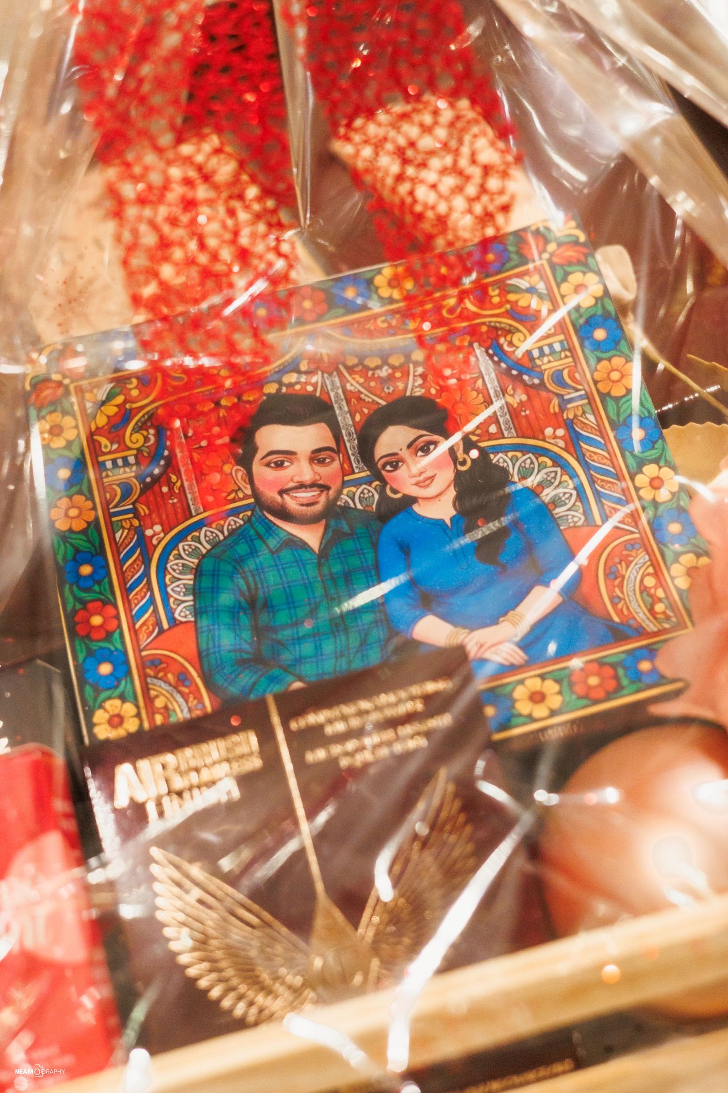 A custom hand-painted bridal portrait of Shadman and Monia, showcased as a unique detail at a traditional Bengali wedding in Washington DC.